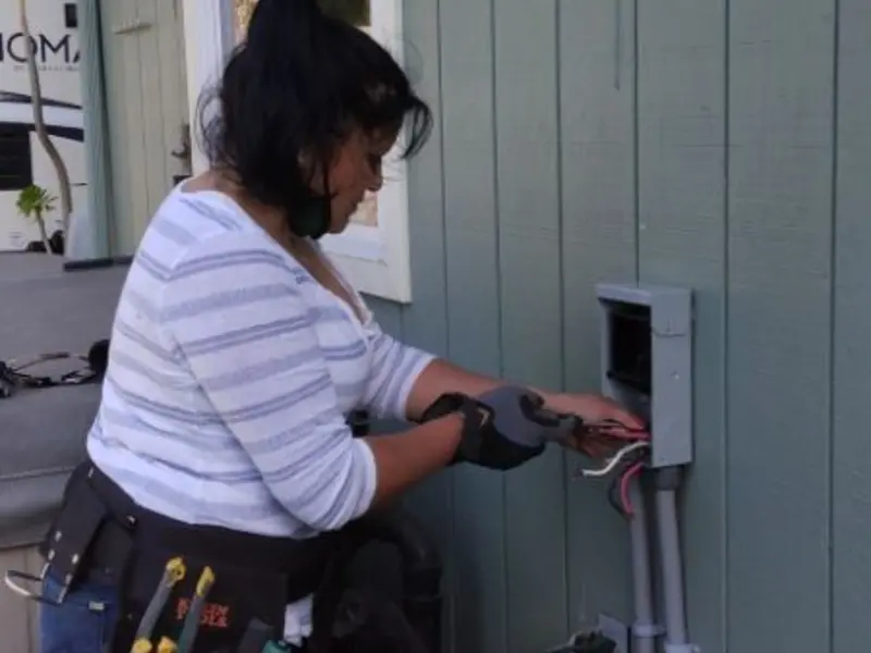 Licensed electrician wiring an exterior subpanel in Mint Hill